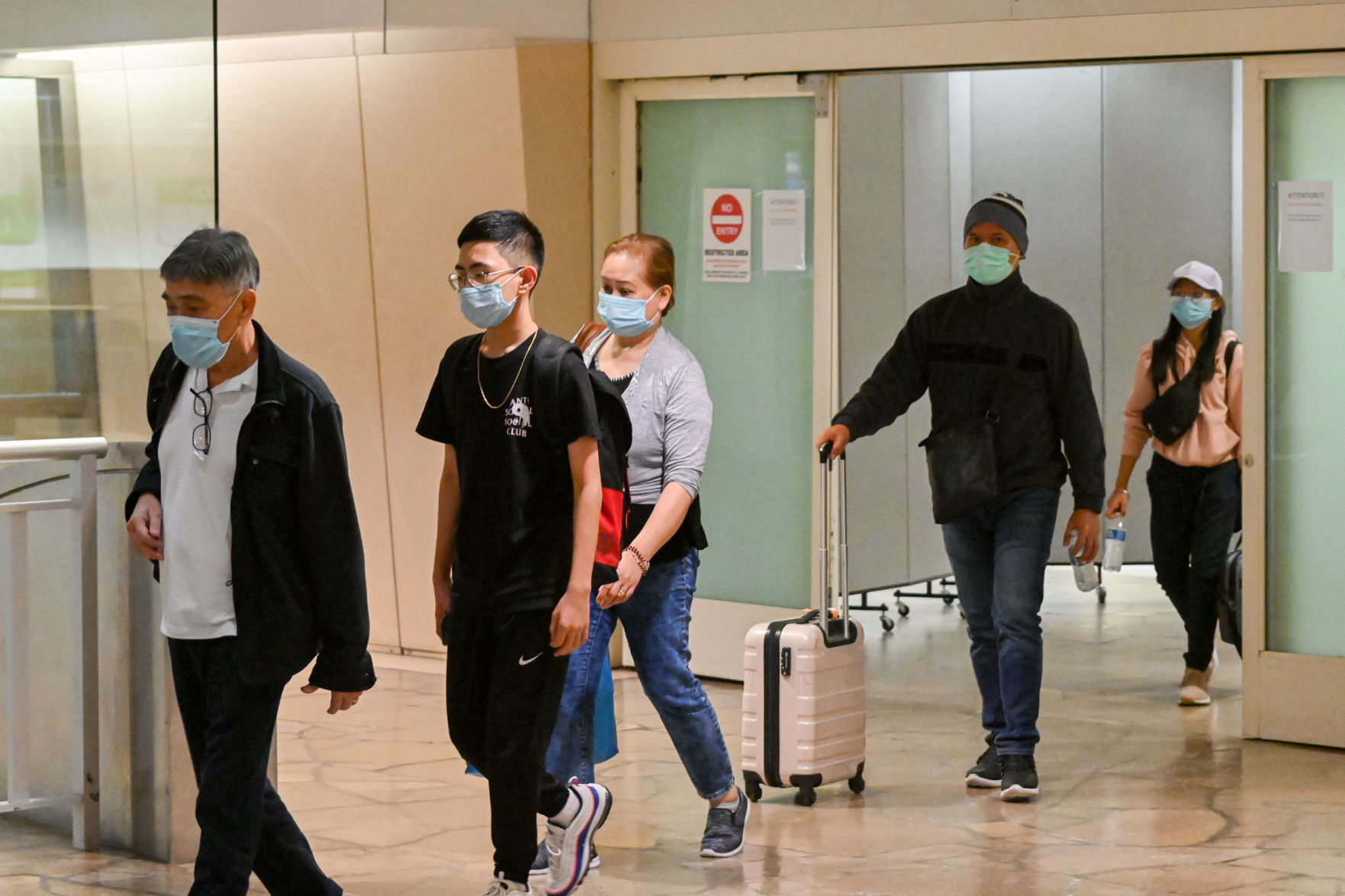 Manila-Guam travel paused due to high virus cases